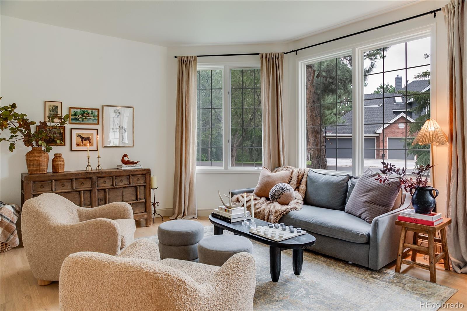475 Silbrico Way Castle Rock, CO 80108 - Photo 9 of 50 a living room with furniture and a large window