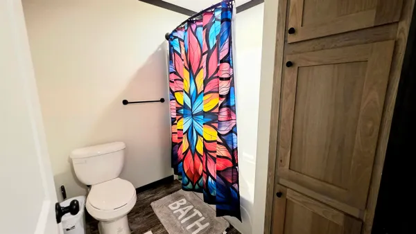 a bathroom with a sink a mirror and a vanity