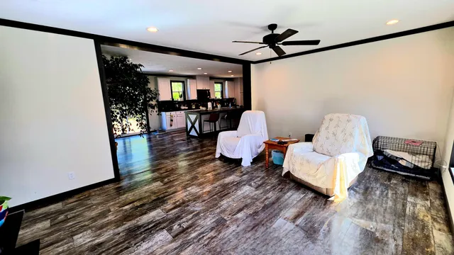 a bathroom with a toilet and a shower curtain