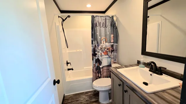 a kitchen with stainless steel appliances granite countertop sink microwave and wooden floor