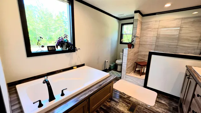 wooden floor with table and chairs