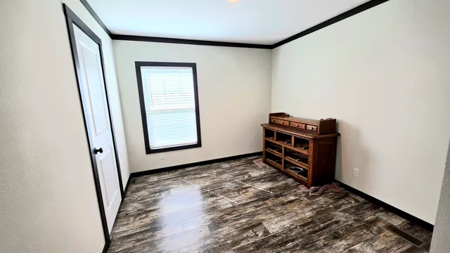 a room with a bed and a window