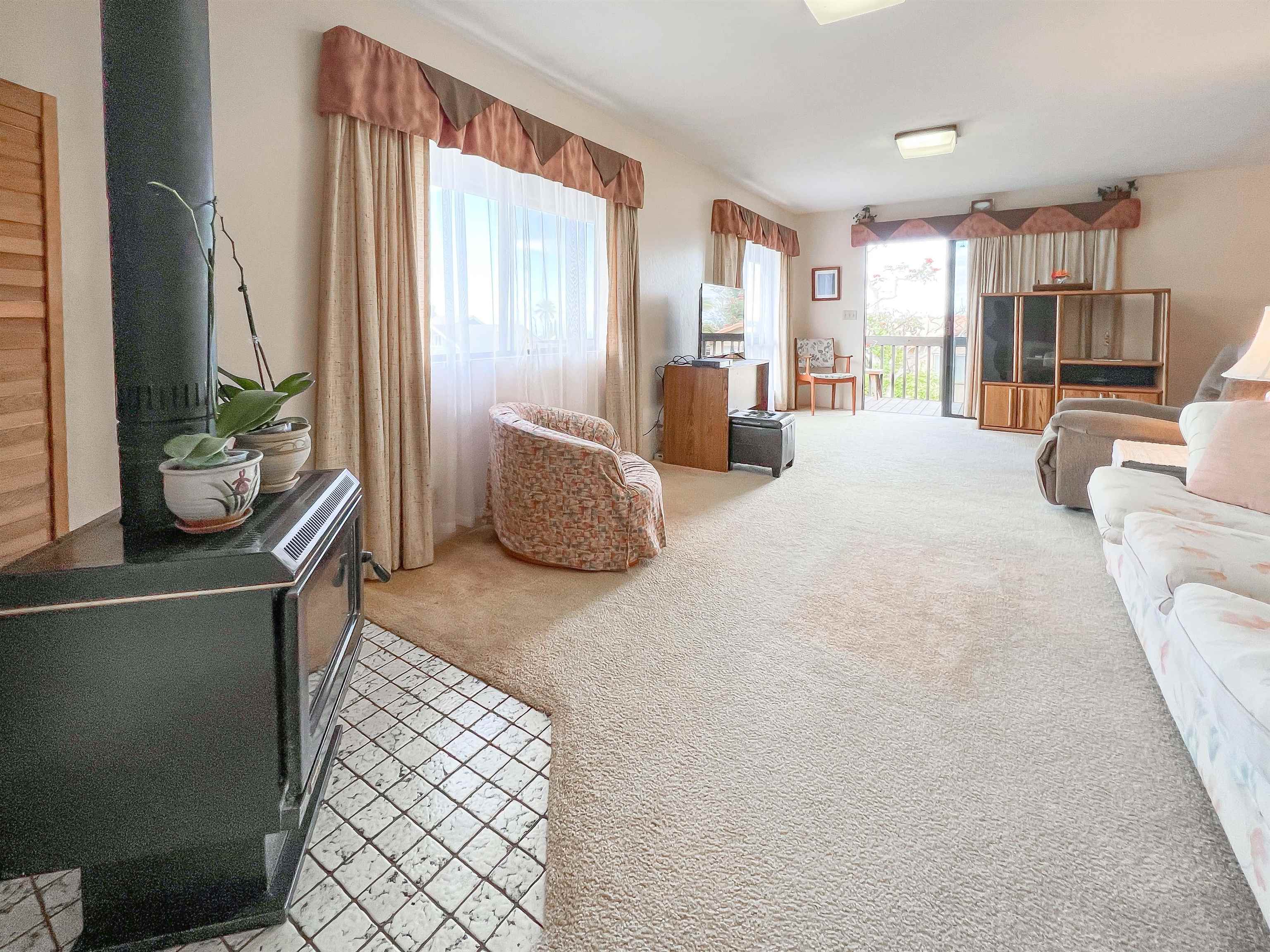 76 Mano Drive Kula, HI 96790 - Photo 16 of 30 a large bedroom with a large bed and large windows