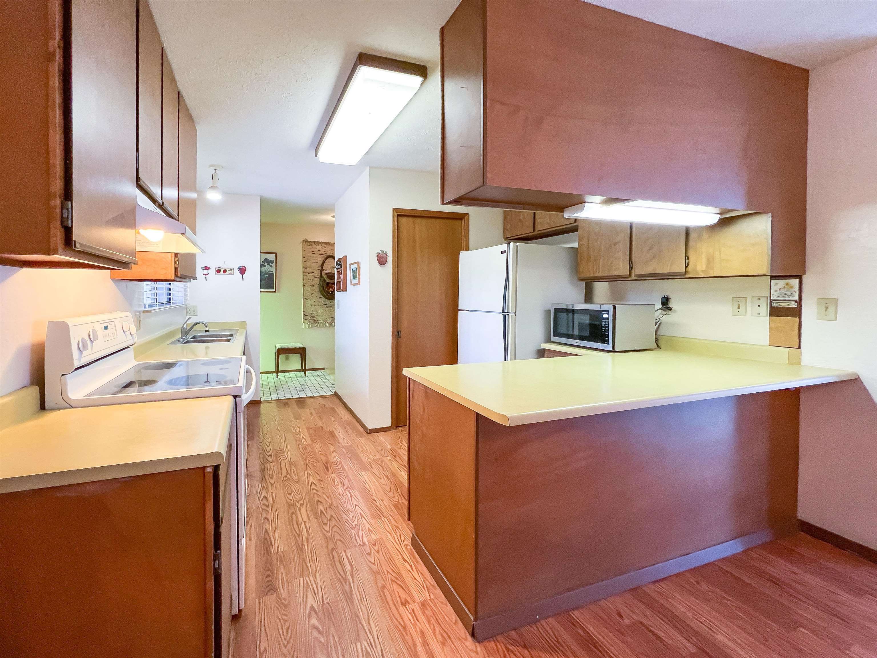 76 Mano Drive Kula, HI 96790 - Photo 26 of 30 a kitchen with kitchen island a sink stove and refrigerator