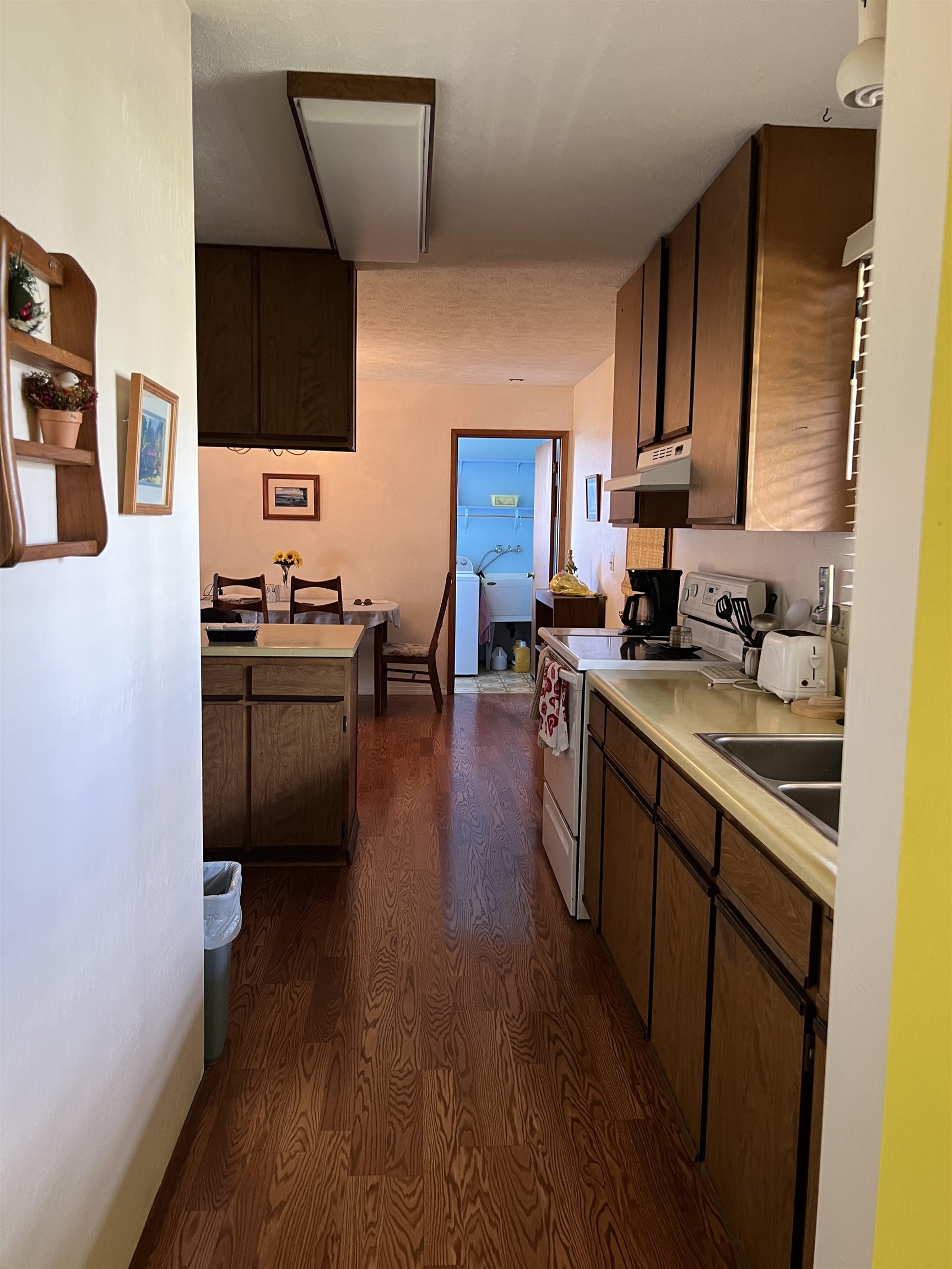 76 Mano Drive Kula, HI 96790 - Photo 28 of 30 a kitchen with a sink cabinets and wooden floor