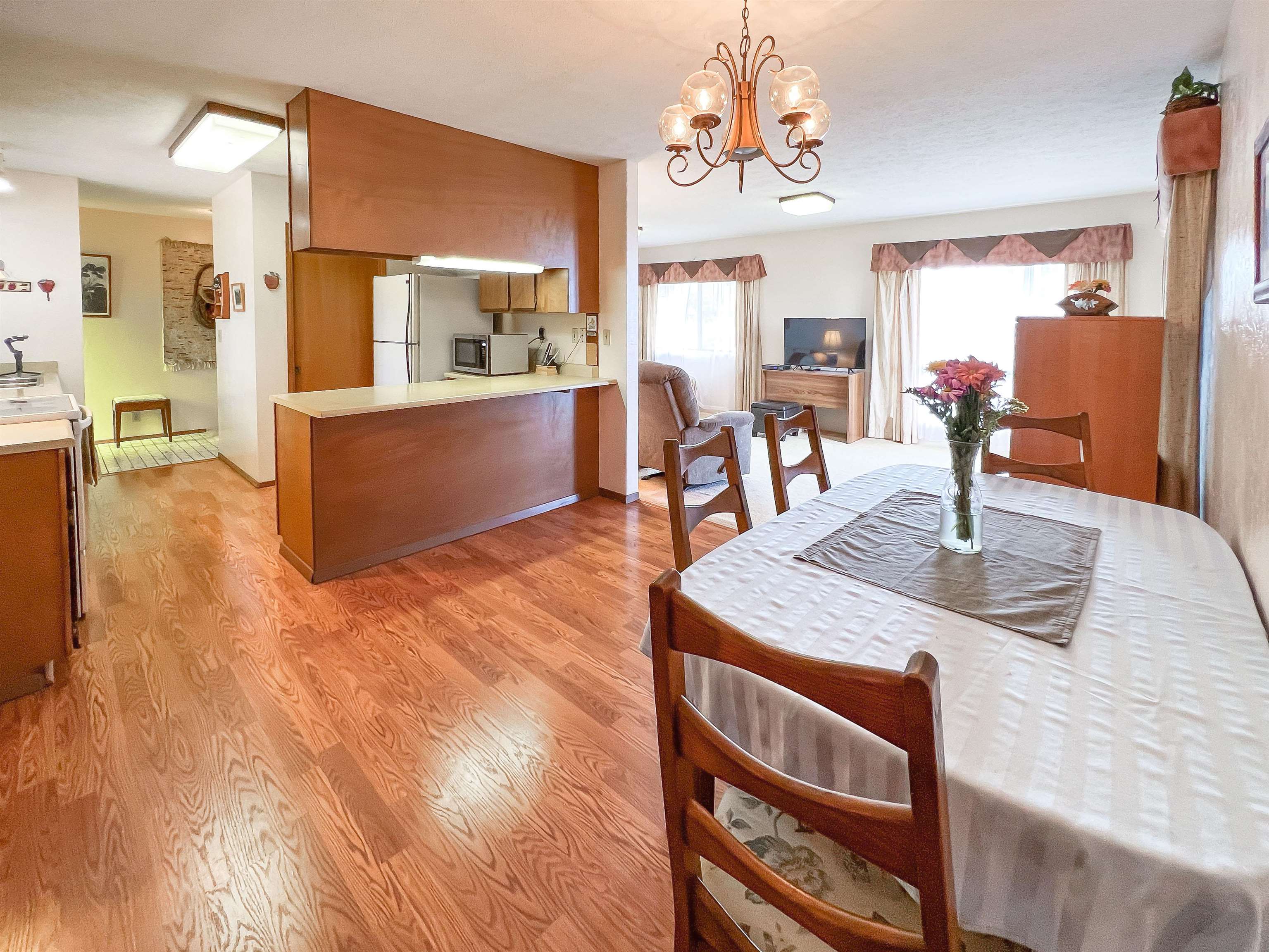 76 Mano Drive Kula, HI 96790 - Photo 4 of 30 a view of a dining room with furniture and a chandelier