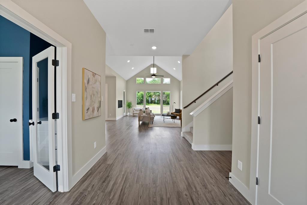 2223 Providence Way Nevada, TX 75173 - Photo 7 of 40 a view of a hallway with wooden floor fireplace and dining room
