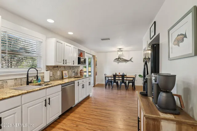 a bathroom with a window and a shower