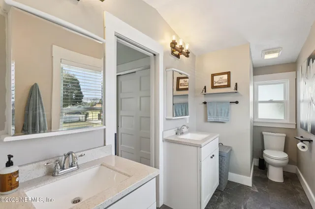 a view of a deck with chairs and wooden floor
