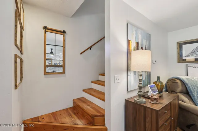 a view of a two chairs in the balcony