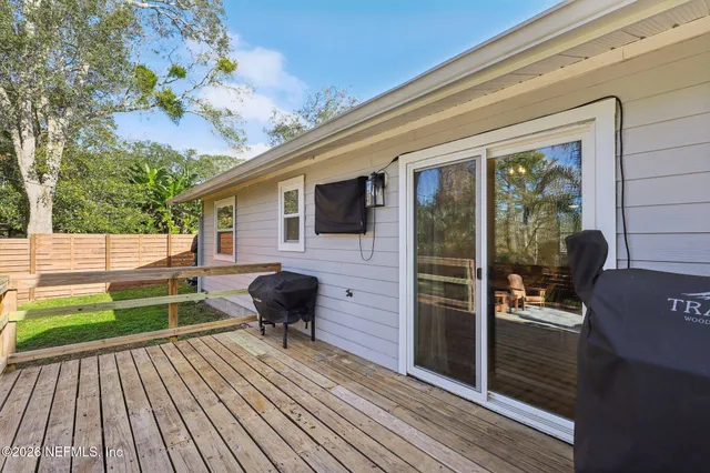 a view of a yard and palm trees
