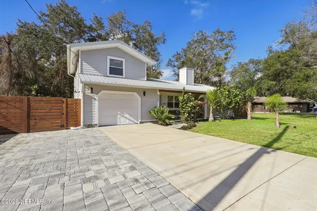 a view of a livingroom with furniture and windows