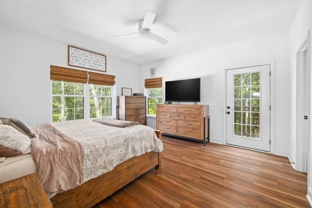 a bathroom with a double vanity sink toilet and mirror