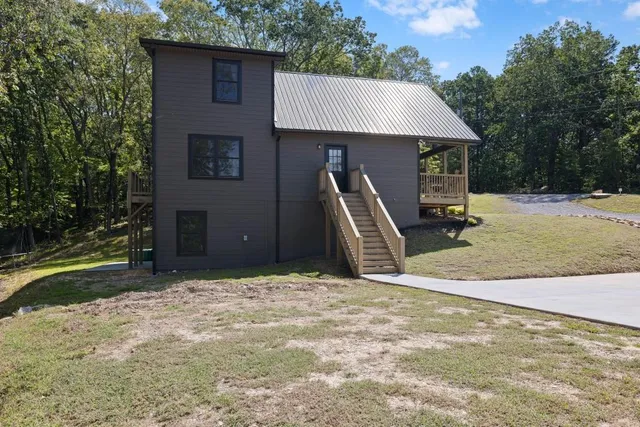 a view of a porch with chairs and backyard