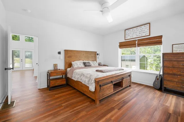 a bed room with a bed and a chair