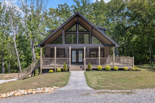 a front view of a house with a yard table and chairs
