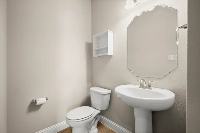 a bathroom with a sink and mirror