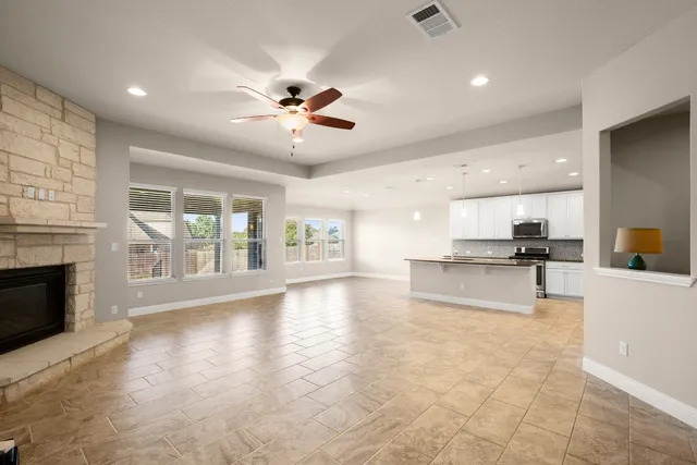 a view of an kitchen with furniture and a fireplace