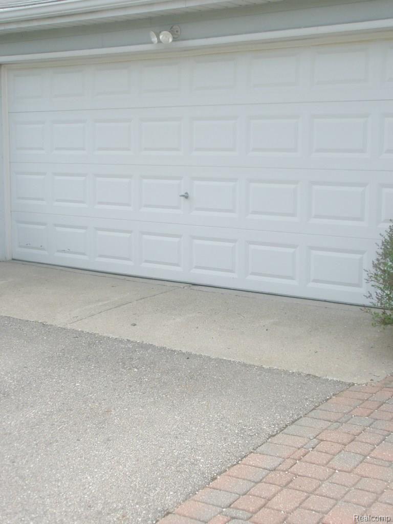1410 John R Road Rochester, MI 48307 - Photo 6 of 34 ATTACHED GARAGE WITH STORAGE CABINETS