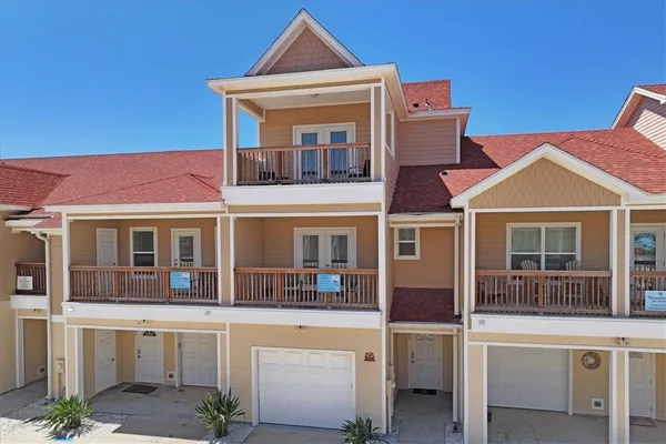 a front view of a house with large windows