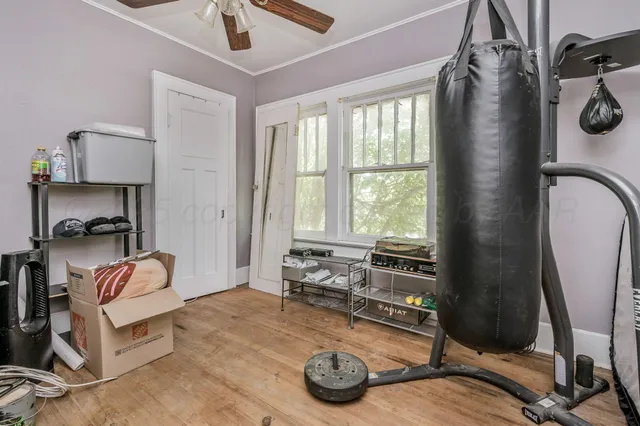 a room with gym equipment and a window