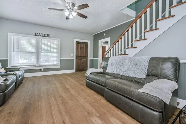 a living room with furniture and a window