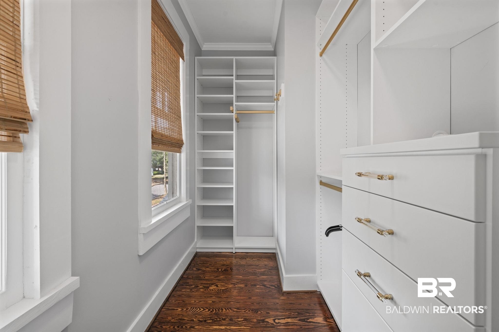123 Macy Place Mobile, AL 36604 - Photo 14 of 35 Walk in closet featuring dark wood-type flooring