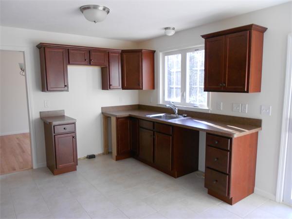 7 Box Turtle Drive Rochester, MA 02770 - Photo 4 of 16 a kitchen with stainless steel appliances granite countertop a stove and a sink