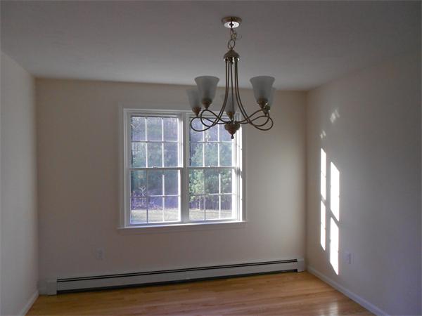 7 Box Turtle Drive Rochester, MA 02770 - Photo 5 of 16 a view of a room with a window and wooden floor