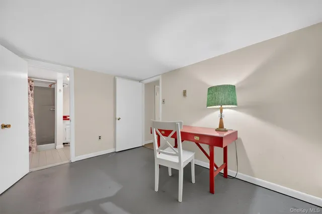 a view of a room with furniture and wooden floor