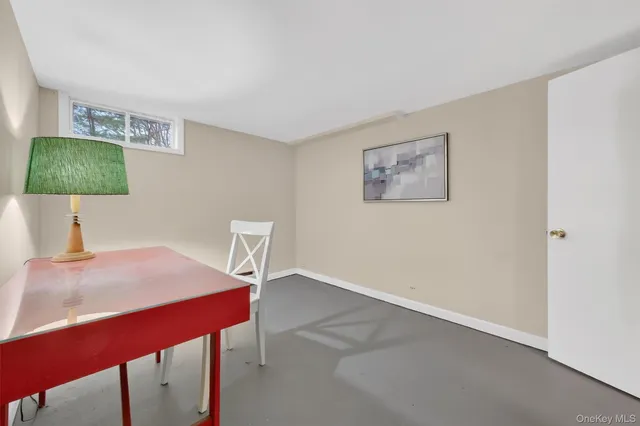 a workspace with furniture and a lamp