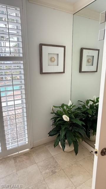 391 4th Street South, Unit 401 Naples, FL 34102 - Photo 9 of 31 a view of a entryway with flower garden