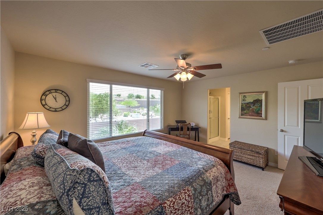 2373 Rue Royale Street Henderson, NV 89044 - Photo 18 of 29 Bedroom featuring carpet, a ceiling fan, and baseb