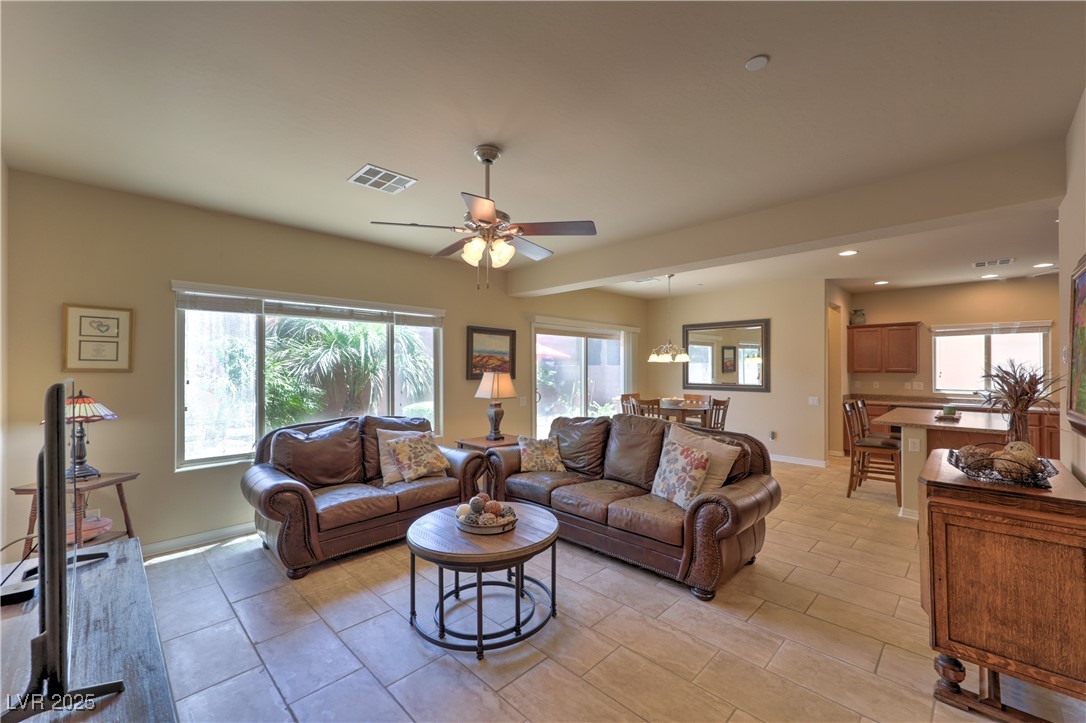 2373 Rue Royale Street Henderson, NV 89044 - Photo 5 of 29 Living room featuring a ceiling fan, baseboards, r
