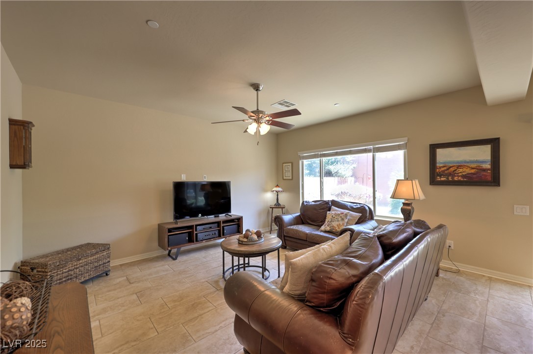 2373 Rue Royale Street Henderson, NV 89044 - Photo 7 of 29 Living area featuring ceiling fan and baseboards