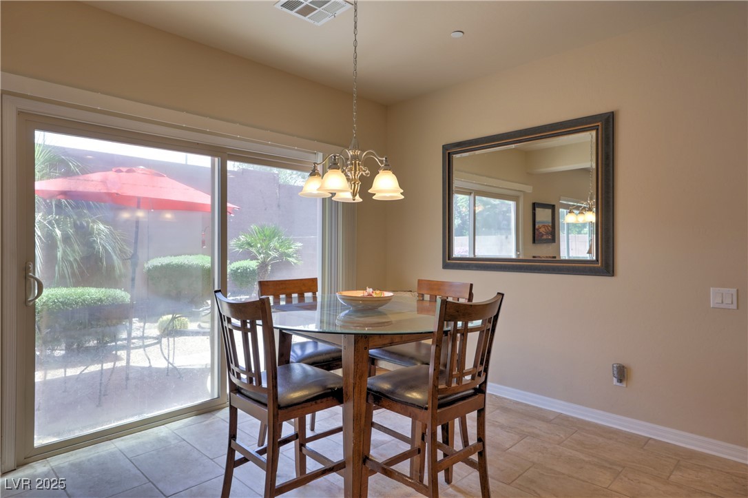 2373 Rue Royale Street Henderson, NV 89044 - Photo 10 of 29 Dining room with a chandelier and baseboards
