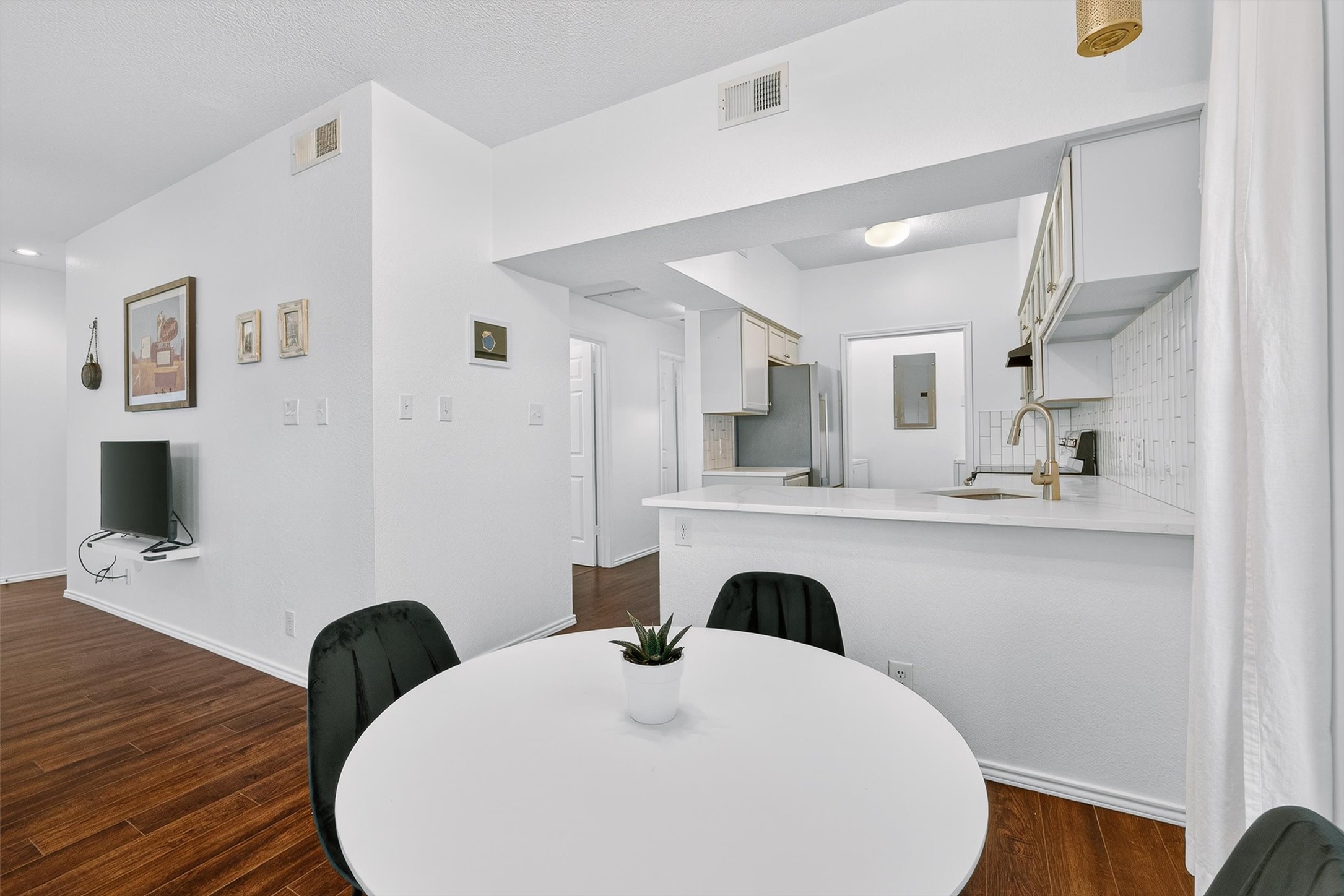 3809 Spicewood Springs Road, Unit 103 Austin, TX 78759 - Photo 10 of 39 Enjoy connecting with guests while you cook in the modern updated kitchen.