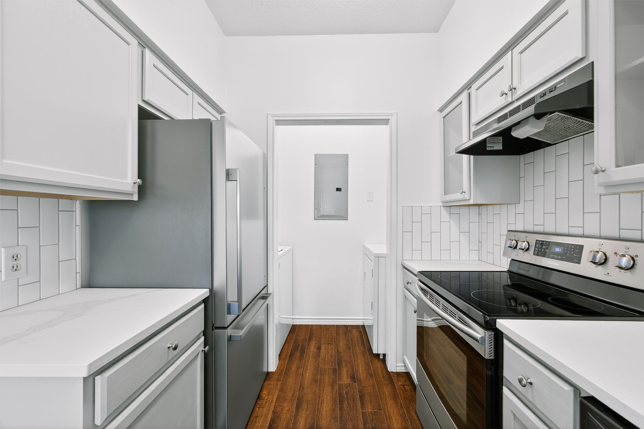 3809 Spicewood Springs Road, Unit 103 Austin, TX 78759 - Photo 15 of 39 Laundry closet is at the end of the kitchen.