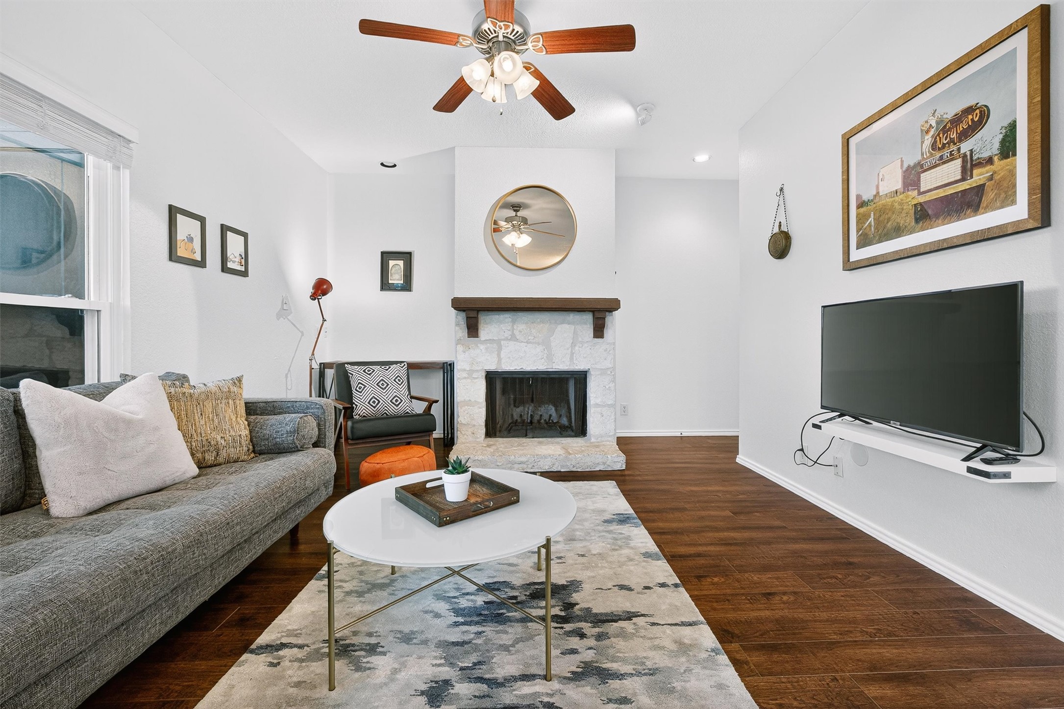 3809 Spicewood Springs Road, Unit 103 Austin, TX 78759 - Photo 6 of 39 Relax by the fireplace while watching TV or reading.