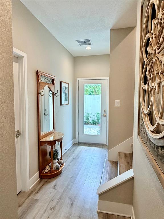 946 Highland Avenue Dunedin, FL 34698 - Photo 11 of 45 a view of room with window and wooden floor