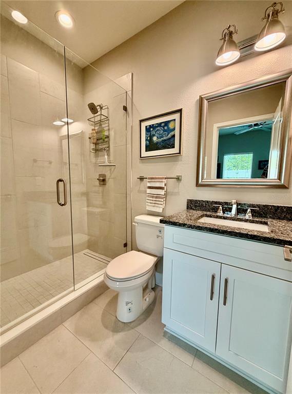 946 Highland Avenue Dunedin, FL 34698 - Photo 14 of 45 a bathroom with a toilet sink and shower