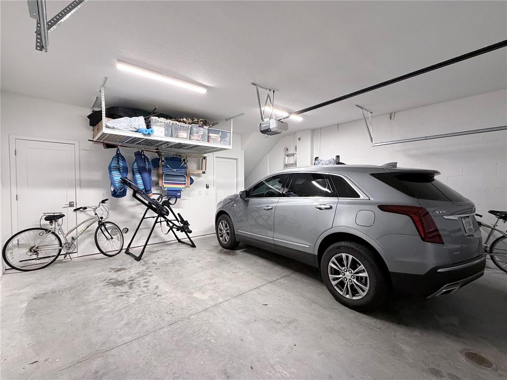 946 Highland Avenue Dunedin, FL 34698 - Photo 16 of 45 a view of a garage with parked cars