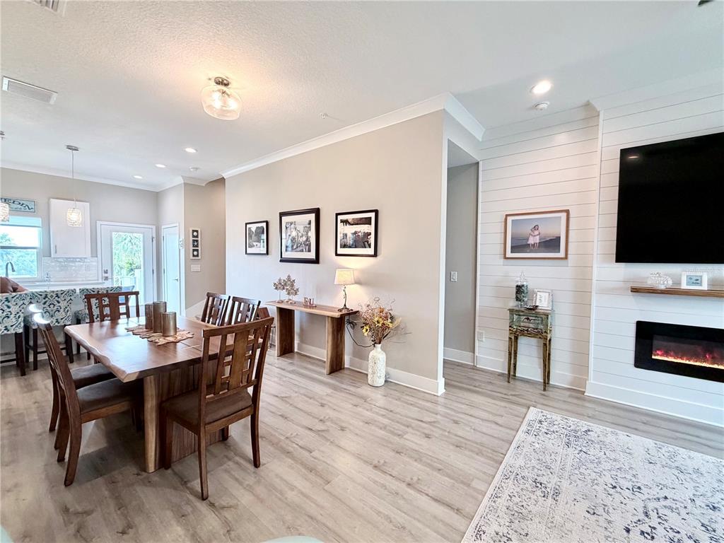 946 Highland Avenue Dunedin, FL 34698 - Photo 23 of 45 a view of a dining room with furniture window and wooden floor