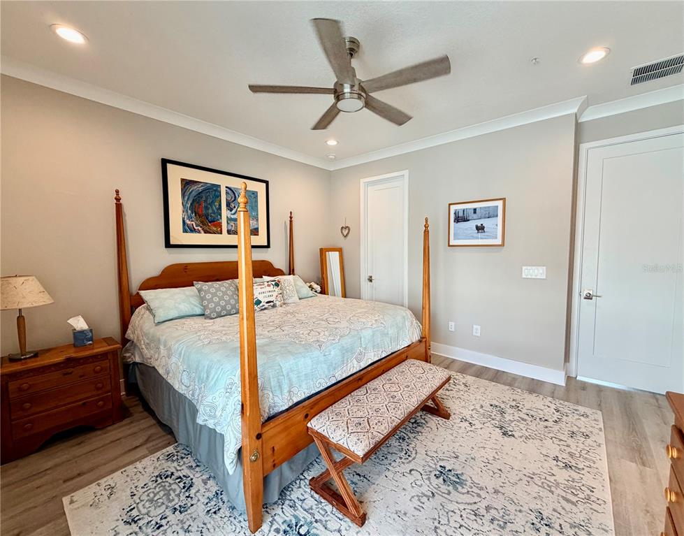 946 Highland Avenue Dunedin, FL 34698 - Photo 30 of 45 a bedroom with a bed and a dresser