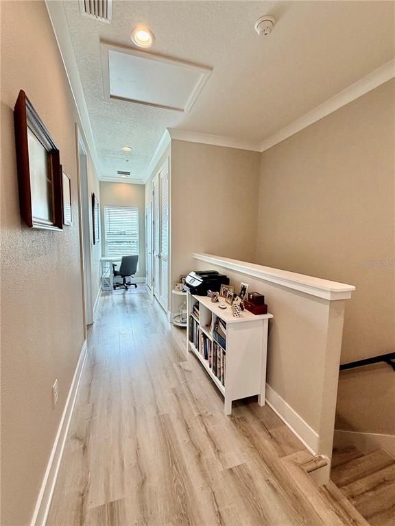 946 Highland Avenue Dunedin, FL 34698 - Photo 31 of 45 a room with furniture and a wooden floor