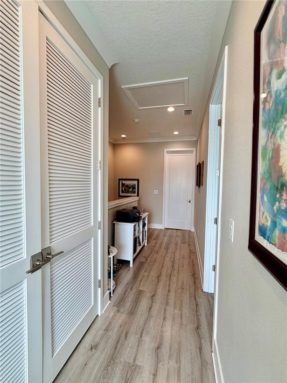 946 Highland Avenue Dunedin, FL 34698 - Photo 32 of 45 a view of a hallway with wooden floor and staircase