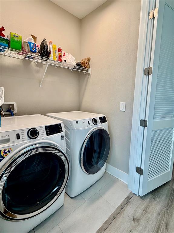 946 Highland Avenue Dunedin, FL 34698 - Photo 33 of 45 a utility room with dryer and washer