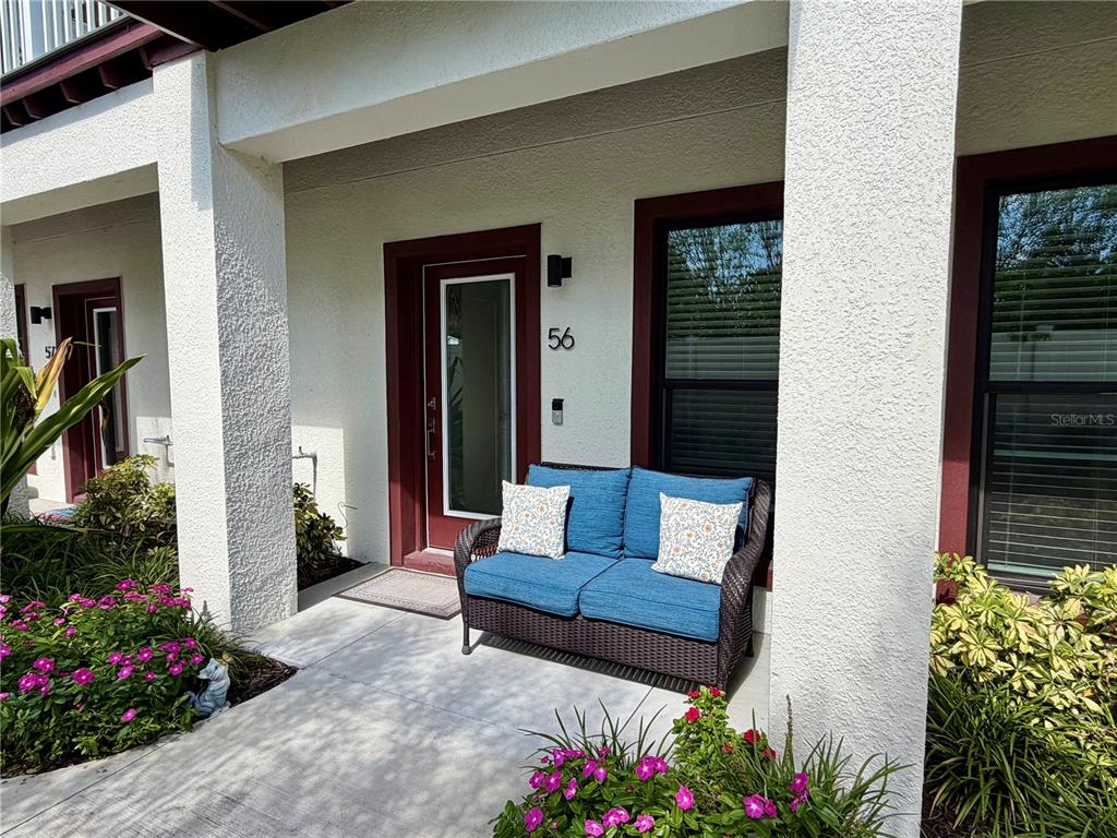 946 Highland Avenue Dunedin, FL 34698 - Photo 4 of 45 a view of bench in front of house