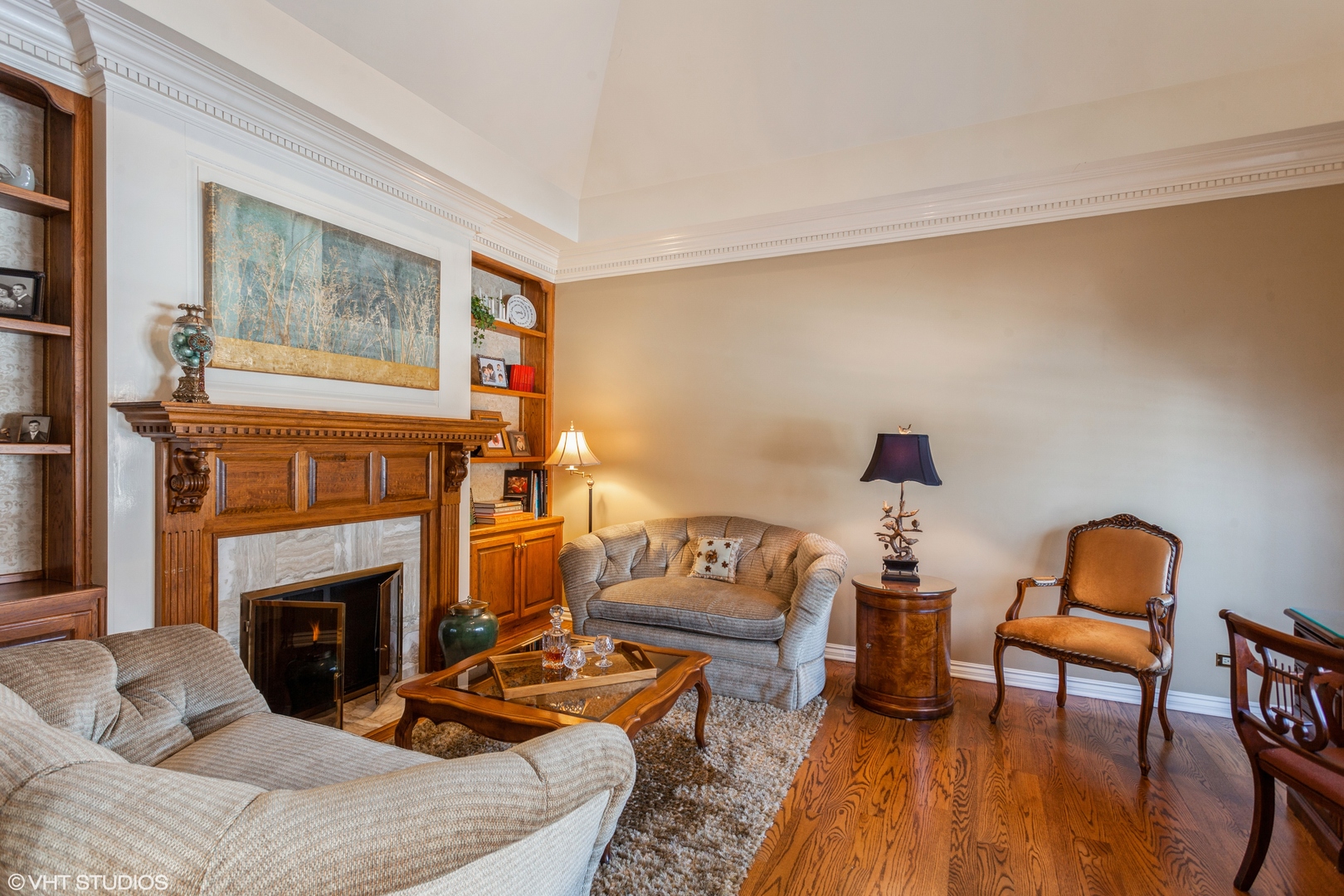 136 Circle Ridge Drive Burr Ridge, IL 60527 - Photo 17 of 38 a living room with furniture and a fireplace