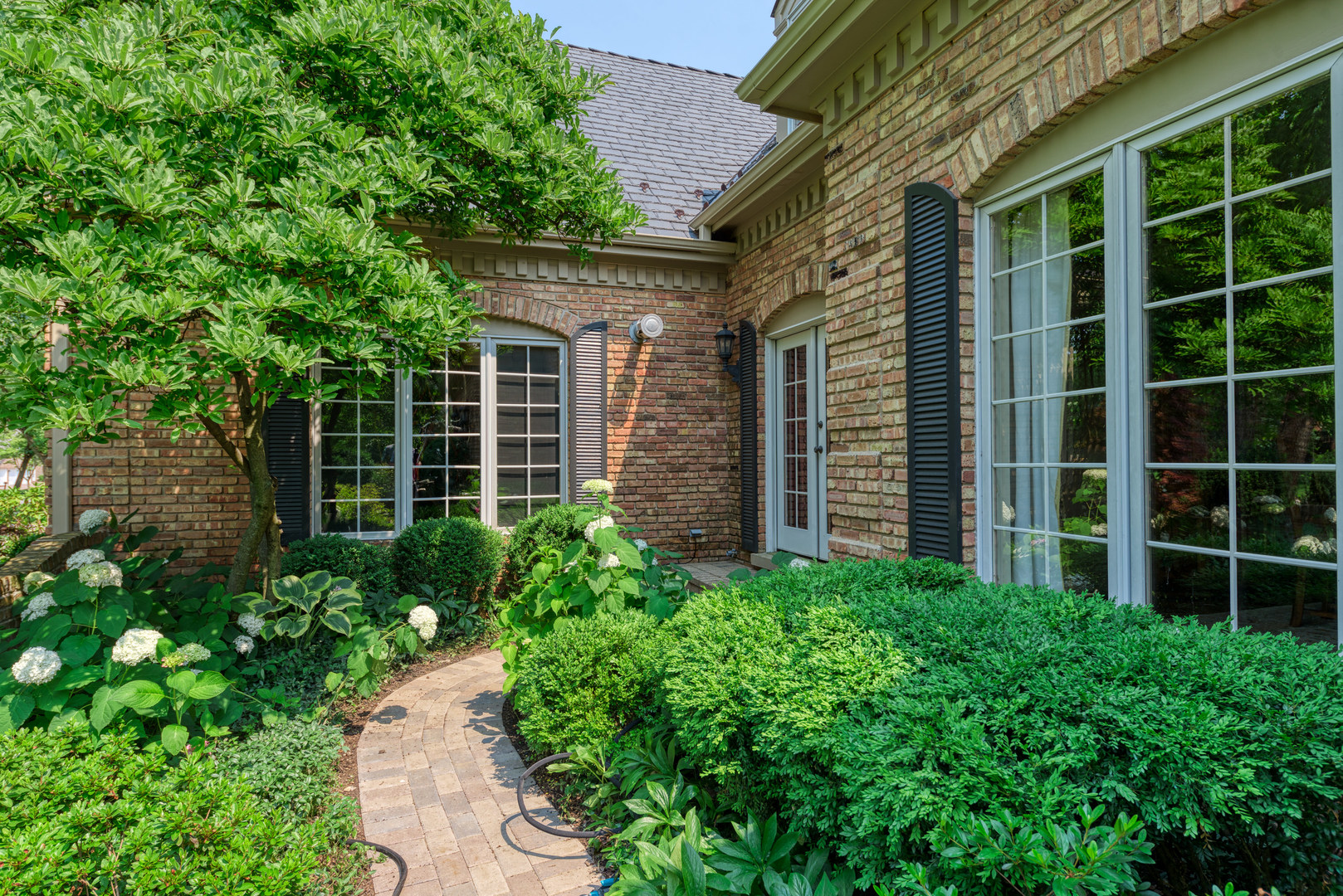 136 Circle Ridge Drive Burr Ridge, IL 60527 - Photo 2 of 38 a view of a pathway with a garden